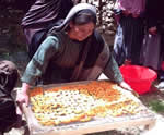 Woman drying fruit