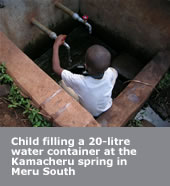 Child filling a 20 litre water container